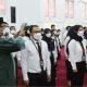 Ilustrasi pengangkatan CPNS dan PPPK tahun 2024 dengan latar belakang kantor pemerintahan.